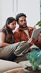 Couple, house and talking with tablet to relax with online post, entertainment or movie choice. Happy man, woman and technology on lounge sofa with app subscription, connection and quality time