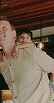 Fun, father and boy in home with piggyback, bonding together and happy moment in living room. Smile, dad and child with family game, parent connection and quality time in playful relationship.