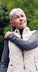 Park, fitness and old woman with shoulder pain, stretching or contemplating with physical discomfort. Massage, muscle strain and senior person with sprain, reflection and exercise accident in nature