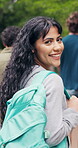Walking, face and girl at university outdoor for travel, journey and trip to class for learning. Portrait, campus and student with backpack for education, study opportunity and knowledge at college