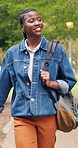 Walking, laugh and woman at college outdoor for travel, journey and trip to class for learning. Thinking, campus and student with backpack for education, study opportunity and knowledge at university