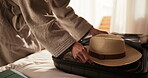 Hands, travel and packing suitcase in bedroom, organizing or getting ready for international holiday. Vacation, preparation and person with luggage on bed, sorting and planning for journey in house