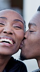 Outdoor, couple and kiss with smile, love and bonding with partner and laughing together on weekend. Black people, affection and connection with spouse on break, happiness and relationship commitment