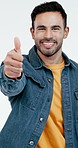 Face, excited and man with thumbs up in studio for approval, agreement and yes for review. Portrait, white background and happy person with emoji for success, positive opinion and feedback for promo