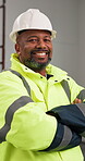 Construction, face and black man with arms crossed, site manager and pride as compliance surveyor. Happy, confidence and mature supervisor with hardhat, safety officer or about us in building project