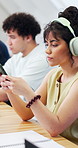 College, student and headphones in class with phone, streaming music and online research for project. Woman, scroll and audio tech in university with podcast, radio and digital quiz for education.