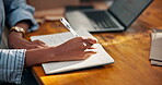 Hands, writing and notebook in supply chain office, logistics management and shipping notes. Person, checklist or agenda for dropshipping information, business quote or details for courier service