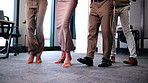 Legs, business people and dance in office for celebration, company performance or accomplishment. Shoes, workplace and employees moving to music with team victory, success or achievement together