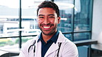 Face, man and confident doctor in hospital for healthcare, wellness service and laugh with happiness. Arms crossed, physician and male person with smile, trustworthy or work ethic of medical employee