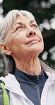 Senior, happy woman and thinking in woods for hiking adventure, scenic break or nature appreciation. Fresh air, pensioner or trekking pause in forest with calm reflection, sightseeing or explore view
