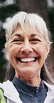 Senior, happy woman and face outdoor for hiking adventure, retirement hobby and active travel. Holiday tourism, pensioner and trekking break in forest with smile, wellness and healthy aging in nature