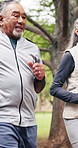 Happy, running and senior couple in park for exercise, training and active together for health. Marriage, retirement and elderly man with woman outdoor for wellness, workout and cardio for fitness