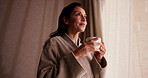 Thinking, coffee and woman in morning at hotel for break on vacation, holiday and getaway by window. Happy, reflection and person with drink, relax and view for accommodation, hospitality and travel