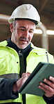 Engineer, scroll and man with tablet on construction site, inspection or renovation research on app. Low angle, mature builder and happy person with tech, browsing and property development on website