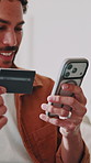 Phone, credit card or man in home for payment, music membership or streaming service transaction. Money transfer, internet banking and happy person with tech, subscription and audio with headphones