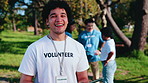 Volunteer, face or happy man with tablet in park for outdoor charity, donation or community service. Portrait, male person or NGO group with smile or technology for contribution or team outreach
