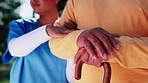 Nurse, hands and patient with walking stick, outdoor and helping senior person in nature and health. Assisted living, caregiver and pensioner with cane, retirement and elderly care for rehabilitation
