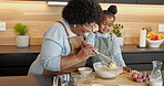 Child, grandma and help in kitchen for baking, food preparation and happy for mixing batter. African family, grandmother and kid in house for teaching method, development and smile with recipe