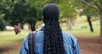 Back, woman and student at park for education, new semester and scholarship for studying abroad. Female person, walking and admission in nature for exchange program, bursary and learning opportunity