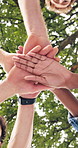 People, students and hand stack for education, scholarship and motivation for new semester. Below, friends and huddle at park for celebration, acceptance and study inclusion for academic achievement