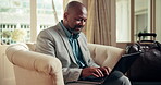 Laptop, travel and business man at hotel lobby for remote work, luggage and internet connection. Mature, black person and typing on computer for freelance job, accomodation check in and schedule